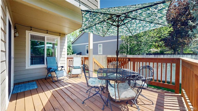 2980 E 135th Dr, Thornton, CO 80241 - wooden terrace featuring outdoor dining area