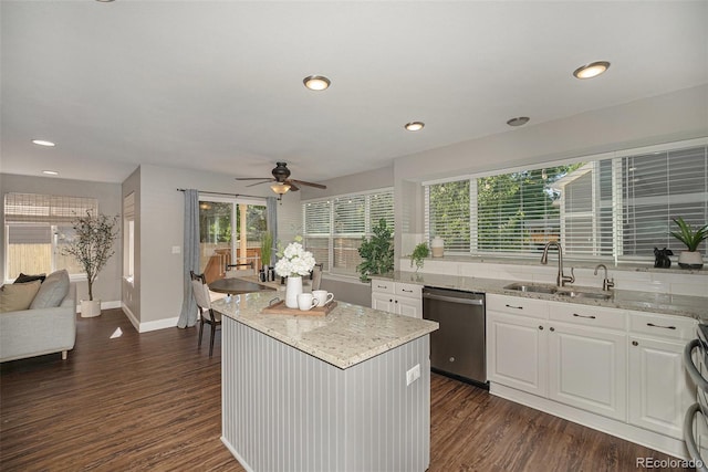 2980 E 135th Dr, Thornton, CO 80241 - kitchen with stainless steel dishwasher, a ceiling fan, light stone countertops, white cabinetry, and dark wood-style flooring