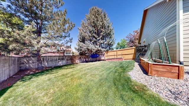 2980 E 135th Dr, Thornton, CO 80241 - fenced backyard with a vegetable garden