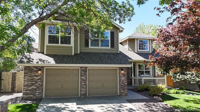 2980 E 135th Dr, Thornton, CO 80241 - traditional-style house with brick siding, concrete driveway, a garage, and a shingled roof