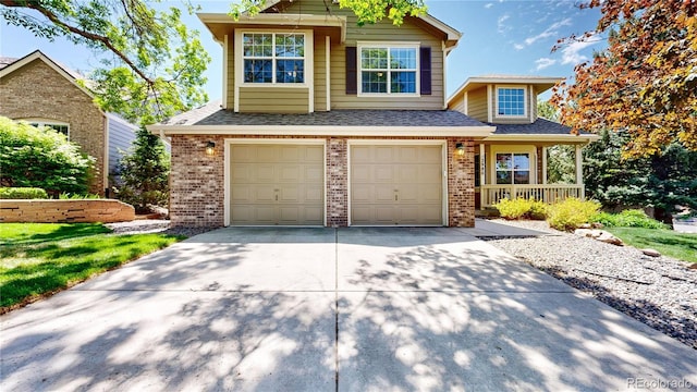 2980 E 135th Dr, Thornton, CO 80241 - view of front of house with brick siding, an attached garage, driveway, and a shingled roof
