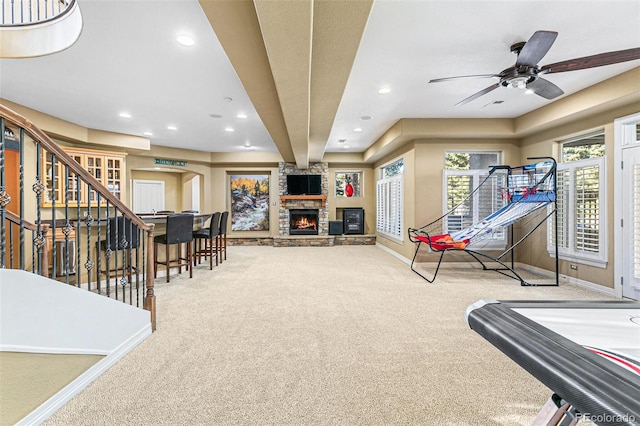 game room with ceiling fan, a fireplace, and carpet