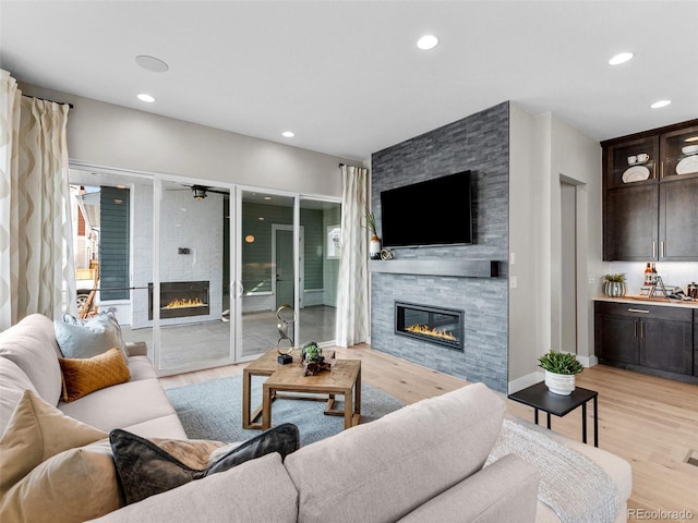 6244 N Lisbon St, Aurora, CO 80019 - living room with a fireplace, light wood finished floors, and recessed lighting