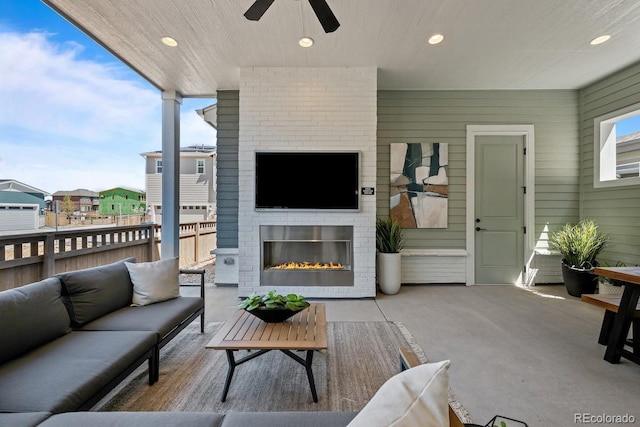6244 N Lisbon St, Aurora, CO 80019 - living room featuring ceiling fan, an outdoor brick fireplace, and recessed lighting