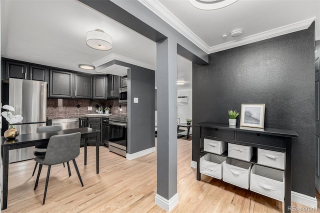 1390 N Emerson St Unit 101, Denver, CO 80218 - kitchen with stainless steel appliances, light wood finished floors, crown molding, backsplash, and a textured wall