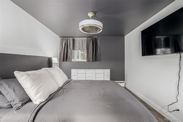 1390 N Emerson St Unit 101, Denver, CO 80218 - bedroom with baseboards and wood finished floors