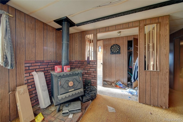 6224 County Road H, Joes, CO 80822 - interior space featuring a wood stove and wood walls
