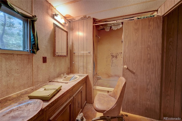 6224 County Road H, Joes, CO 80822 - full bathroom featuring shower / tub combination, double vanity, a textured ceiling, and toilet