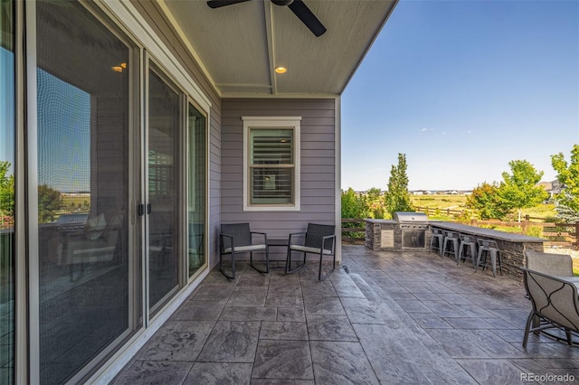 3256 Offbeaten Pl, Castle Rock, CO 80108 - view of patio / terrace featuring a ceiling fan and exterior kitchen