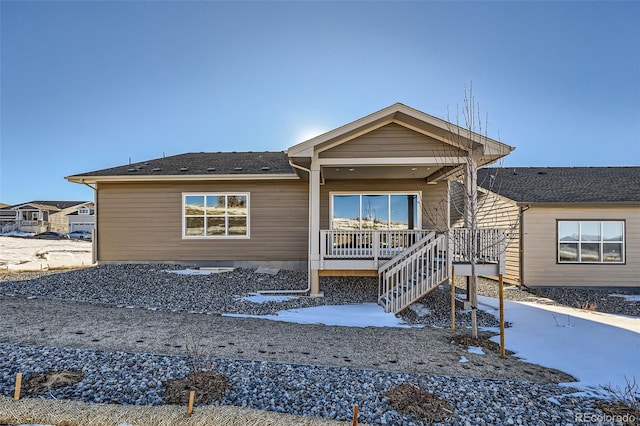 single story home with a porch