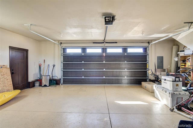 104 River Run Dr, Buena Vista, CO 81211 - garage with electric panel and a garage door opener
