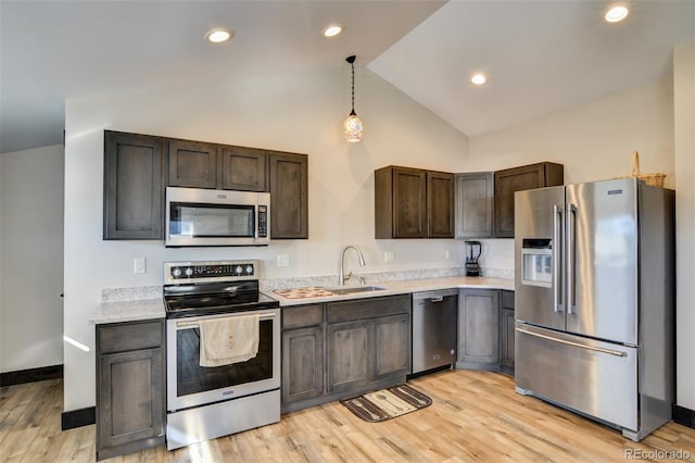 104 River Run Dr, Buena Vista, CO 81211 - kitchen featuring stainless steel appliances, light countertops, dark brown cabinets, pendant lighting, and light wood-type flooring