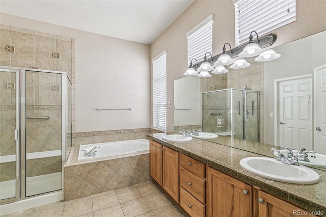6085 Nile Cir, Golden, CO 80403 - full bath featuring a stall shower, a bath, double vanity, and tile patterned floors