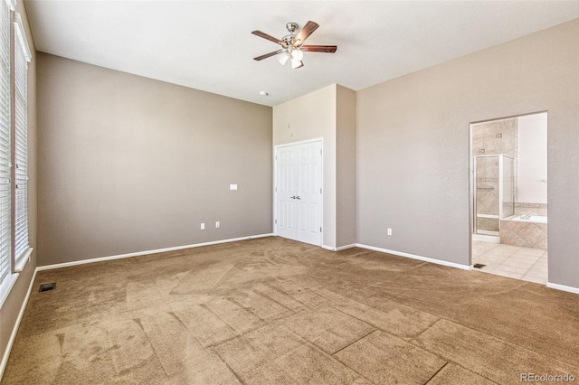 6085 Nile Cir, Golden, CO 80403 - unfurnished bedroom with carpet floors, ensuite bath, a ceiling fan, and a closet
