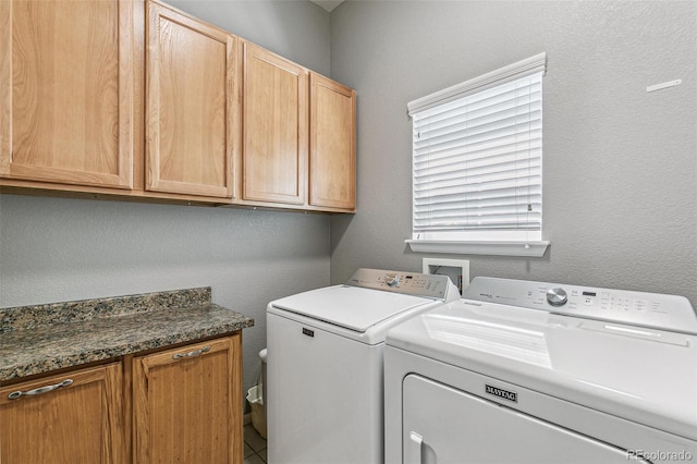 6085 Nile Cir, Golden, CO 80403 - laundry room featuring cabinet space, separate washer and dryer, and a textured wall