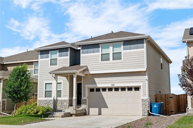 244 Chipeta Way, Lochbuie, CO 80603 - view of front of house with concrete driveway, stone siding, an attached garage, and a shingled roof