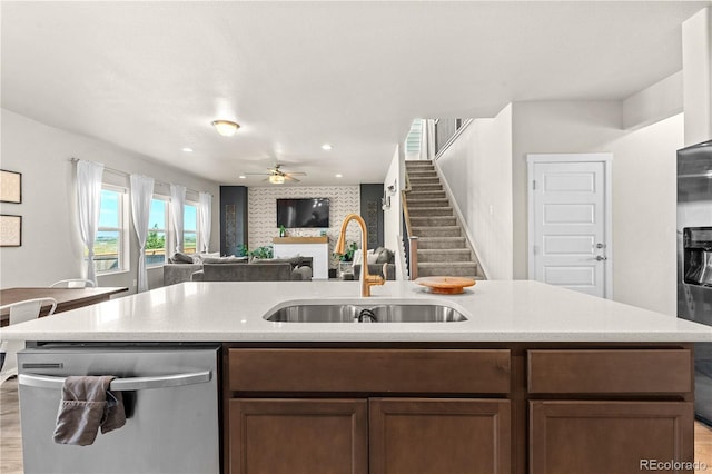 244 Chipeta Way, Lochbuie, CO 80603 - kitchen with stainless steel appliances, open floor plan, a ceiling fan, light countertops, and recessed lighting