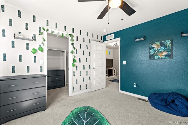 244 Chipeta Way, Lochbuie, CO 80603 - bedroom featuring carpet floors, a walk in closet, and a ceiling fan