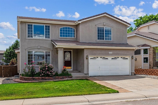 4848 Fenwood Dr, Highlands Ranch, CO 80130 - traditional-style house featuring driveway, stucco siding, and a garage
