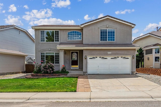 4848 Fenwood Dr, Highlands Ranch, CO 80130 - traditional-style house with concrete driveway, stucco siding, a garage, and a front yard