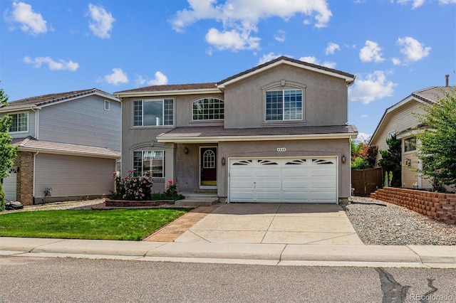 4848 Fenwood Dr, Highlands Ranch, CO 80130 - traditional-style house with stucco siding, a garage, and concrete driveway