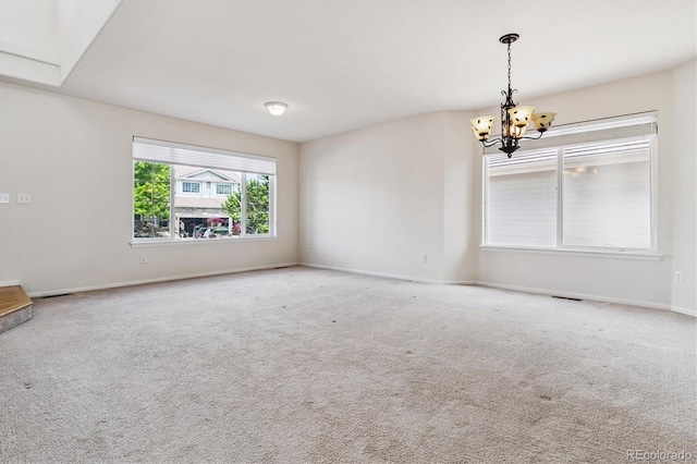 4848 Fenwood Dr, Highlands Ranch, CO 80130 - carpeted empty room with a chandelier and baseboards