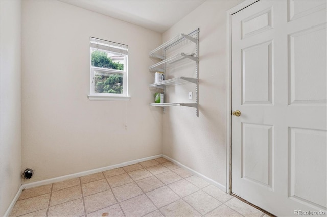 4848 Fenwood Dr, Highlands Ranch, CO 80130 - washroom with baseboards and light tile patterned flooring