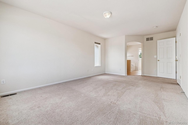 4848 Fenwood Dr, Highlands Ranch, CO 80130 - empty room featuring arched walkways and light carpet