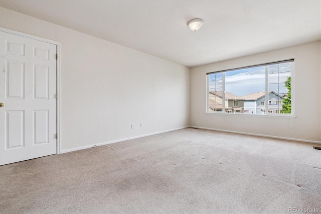 4848 Fenwood Dr, Highlands Ranch, CO 80130 - carpeted empty room featuring baseboards