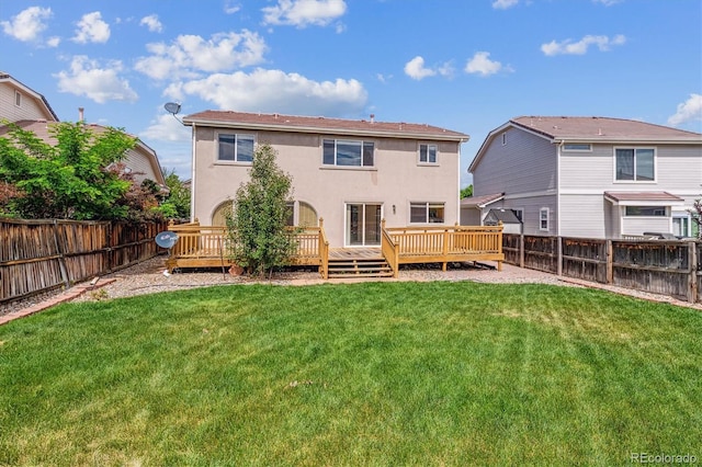 4848 Fenwood Dr, Highlands Ranch, CO 80130 - rear view of property featuring stucco siding, a fenced backyard, and a wooden deck