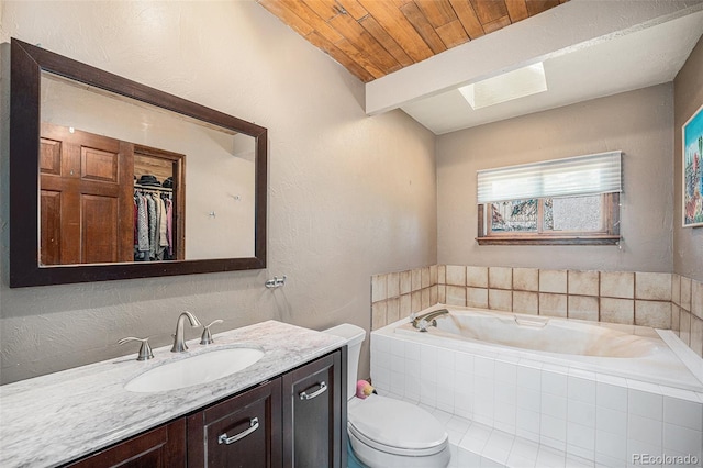 bathroom with a textured wall, toilet, wood ceiling, vanity, and a bath