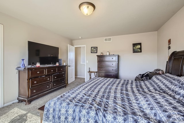 bedroom featuring carpet floors, visible vents, and baseboards