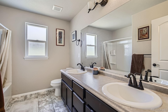 bathroom with plenty of natural light, baseboards, and a sink