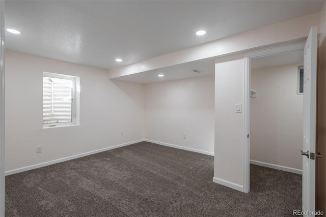 basement with dark carpet