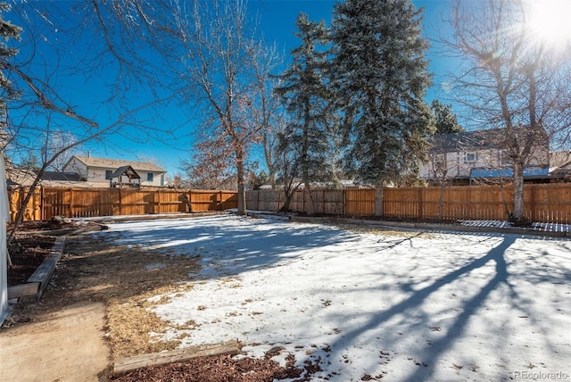 view of yard covered in snow