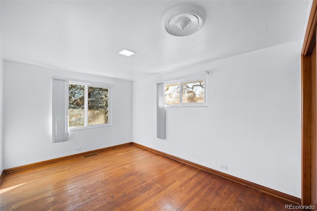 3131 S Washington St, Englewood, CO 80113 - empty room featuring hardwood / wood-style flooring and baseboards