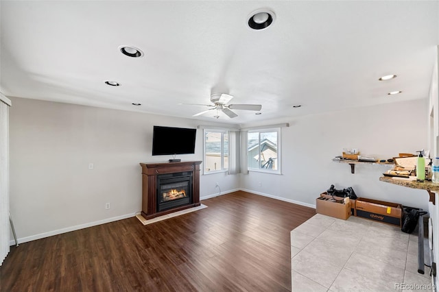 3131 S Washington St, Englewood, CO 80113 - unfurnished living room featuring a ceiling fan, a glass covered fireplace, wood finished floors, and recessed lighting