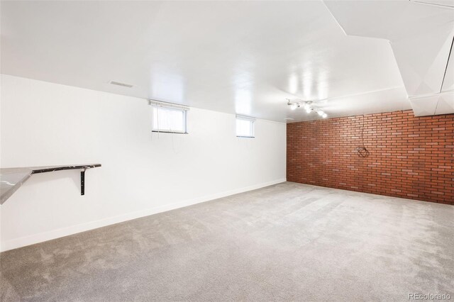 3131 S Washington St, Englewood, CO 80113 - basement featuring brick wall and carpet floors