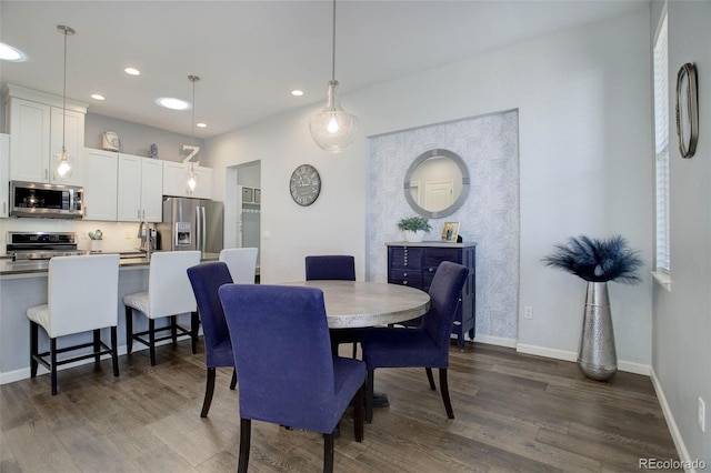 dining space with recessed lighting, baseboards, and dark wood-style flooring