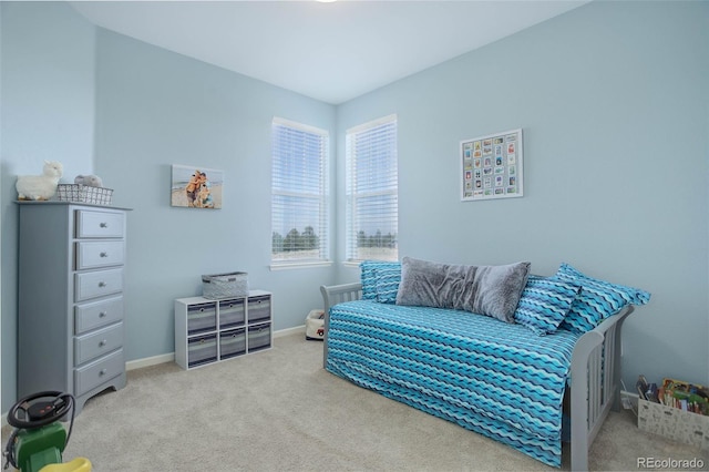 carpeted bedroom with baseboards