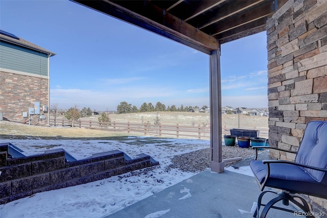 view of patio featuring fence