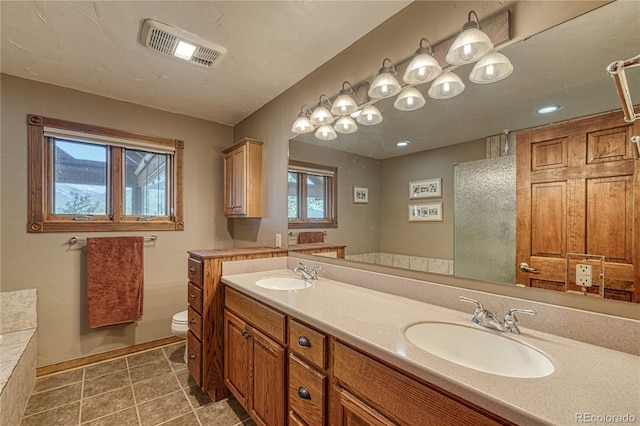 full bathroom with double vanity, visible vents, toilet, and a sink