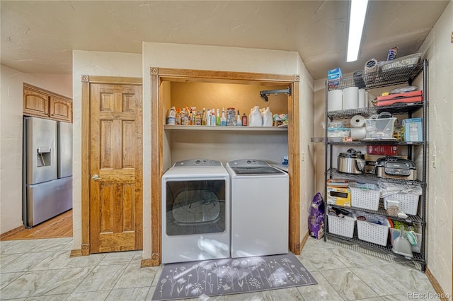 laundry area with laundry area and washer and clothes dryer