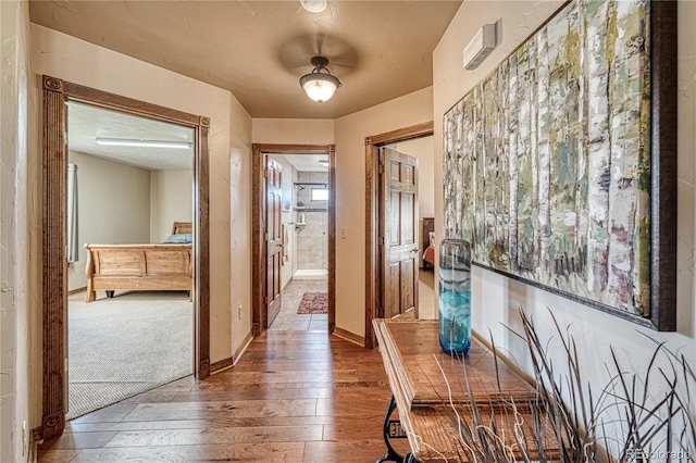 corridor featuring hardwood / wood-style floors