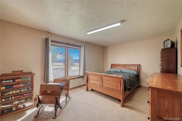 carpeted bedroom with a textured ceiling