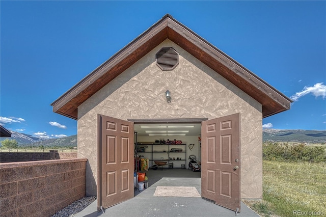 view of outbuilding featuring a mountain view