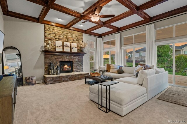 27290 E Nova Cir, Aurora, CO 80016 - carpeted living area with coffered ceiling, healthy amount of natural light, a ceiling fan, a fireplace, and beamed ceiling
