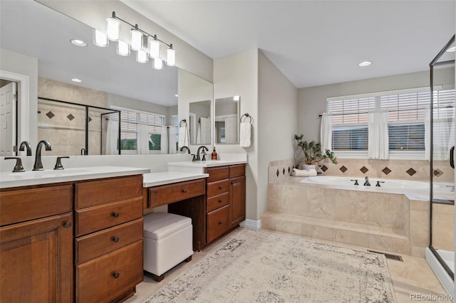 27290 E Nova Cir, Aurora, CO 80016 - bathroom featuring vanity, a stall shower, a bath, and recessed lighting