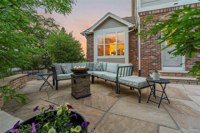 27290 E Nova Cir, Aurora, CO 80016 - patio terrace at dusk featuring a patio and an outdoor living space with a fire pit