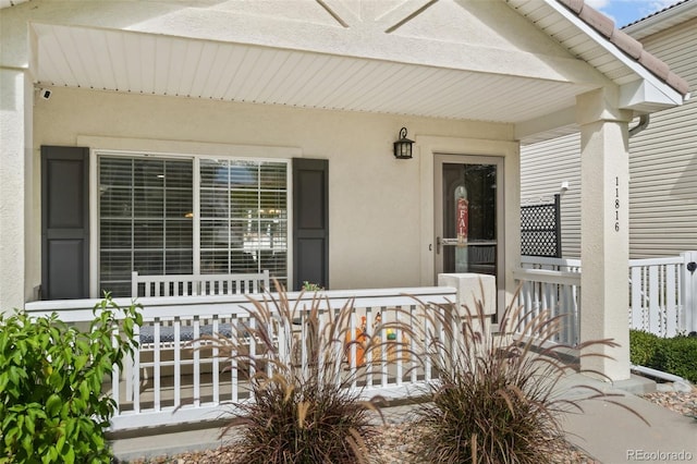 doorway to property with stucco siding